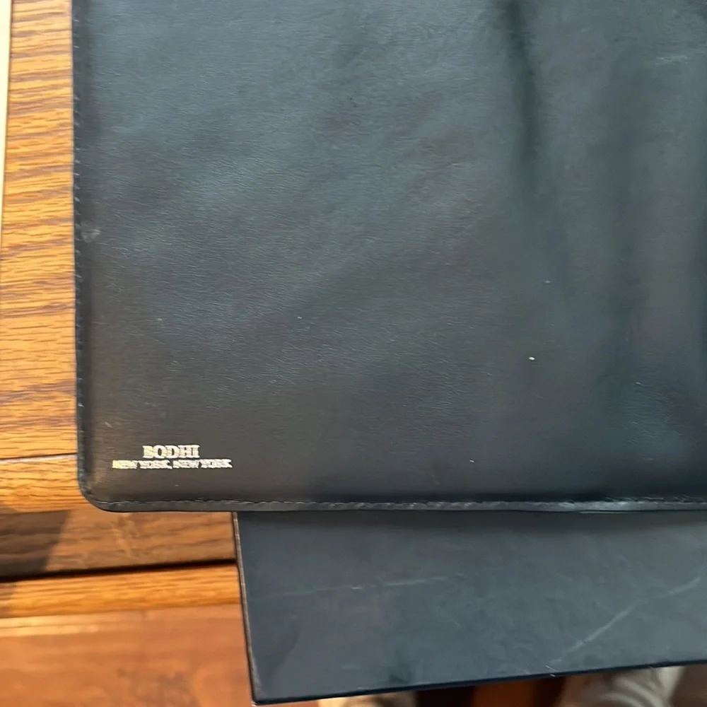 iPad convertible jacket by Bisho small leather goods.